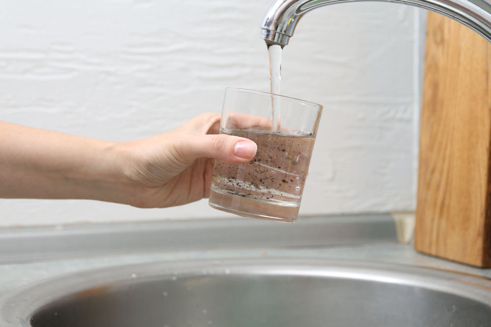discolored water in glass